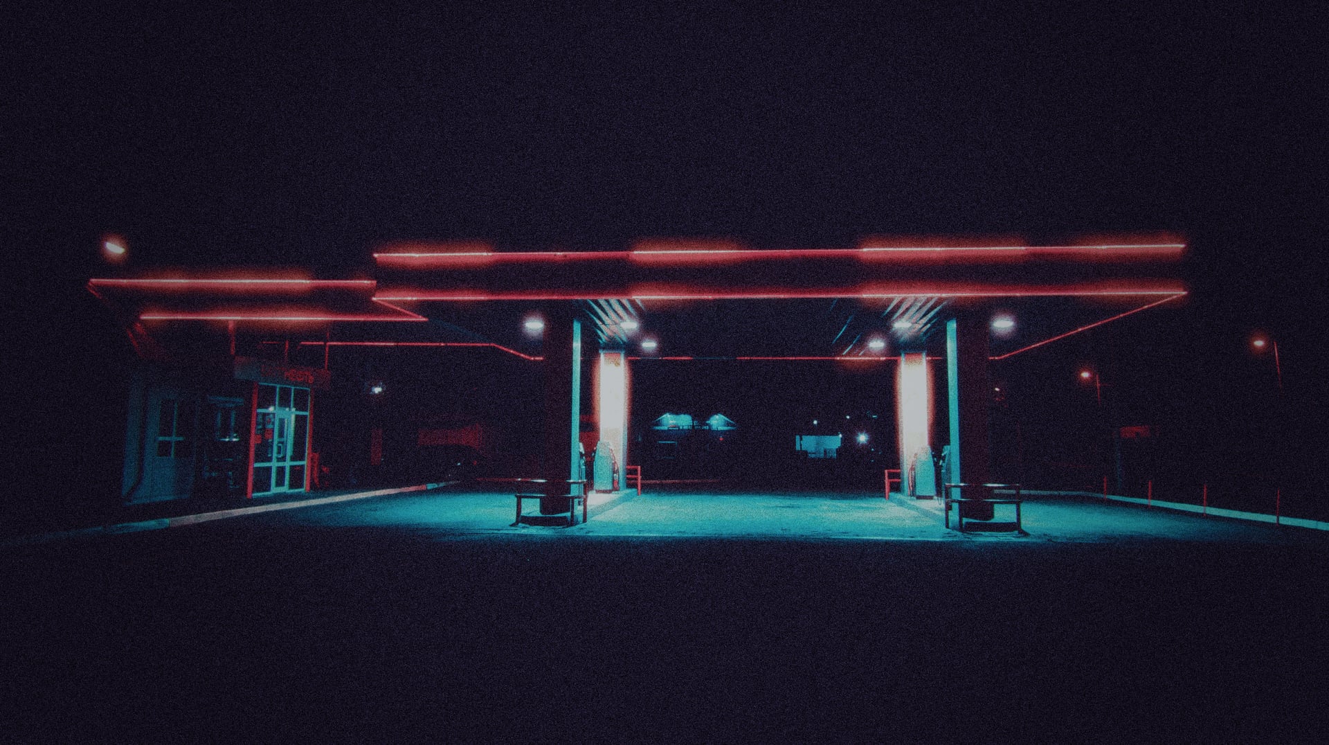 Gas station at night with cinematic red neon halation and cyan lighting shot with Daydream Nightcall preset